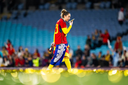 goalkeeper Cata Coll of Spain talks on the phone as she celebrates