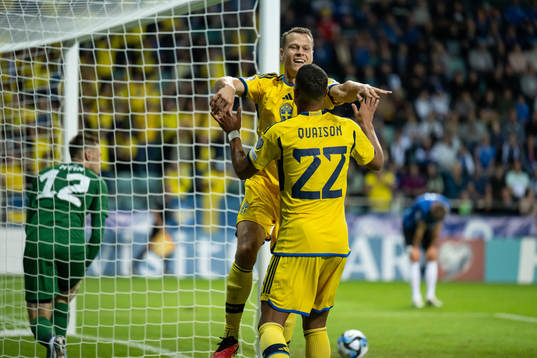 Viktor Claesson and Robin Quaison of Sweden celebrate after scoring 0-4 