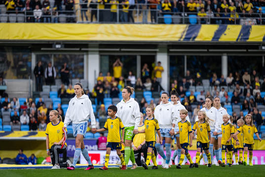 Irene Paredes and goalkeeper Cata Coll of Spain enter the
