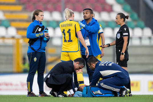 Stina Blackstenius of Sweden in pain and being taken care