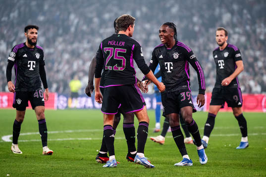 Thomas Muller and Mathys Tel of Bayern Munich celebrate after scoring 1-2