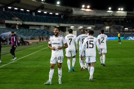 Juninho of Qarabag celebrate with teammates after the 0-1 goal
