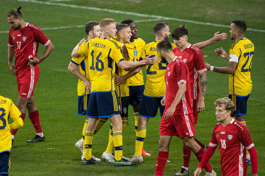 Jesper Karlsson and Robin Quaison of Sweden celebrating 3-1