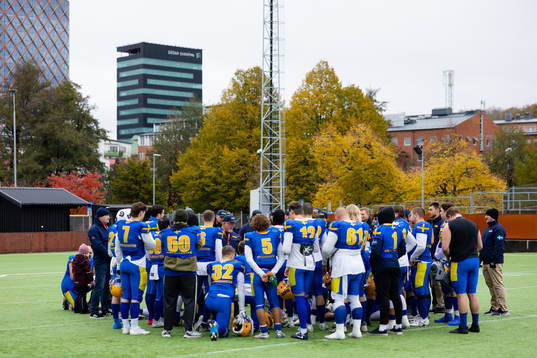 Players and staff gathered