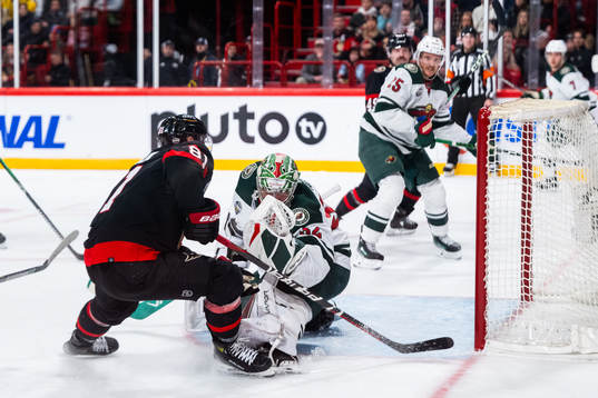 Dominik Kubalik of Ottawa Senators and goaltender Filip