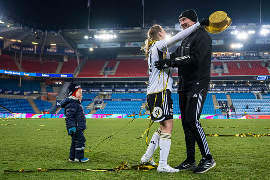 Kristine Minde of Rosenborg and Steinar Lein, head coach of Rosenborg, celebrates with the trophy