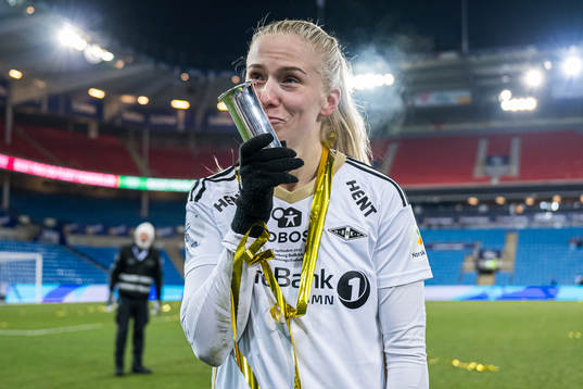 Emilie Nautnes of Rosenborg celebrates with the trophy
