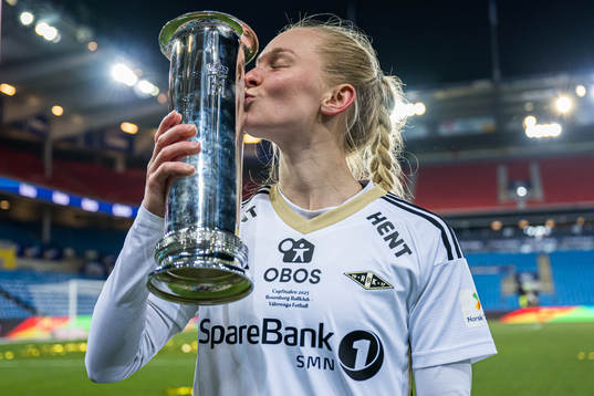 Emilie Marie Joramo of Rosenborg celebrates with the trophy