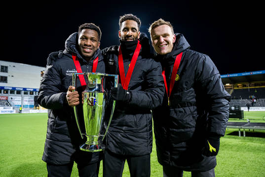 Pemi Moumbagna Faris, Amahl Pellegrino and Marius Lode of Bodø/Glimt celebrates with the trophy