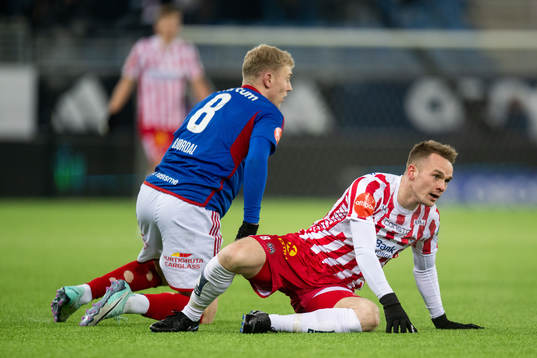 Henrik Bjørdal  of Vålerenga and Kent-Are Antonsen of Tromsø