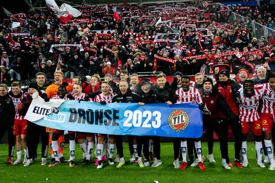 Players of Tromsø celebrate the bronze medal