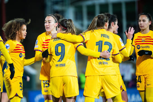 Mariona Caldentey of Barcelona celebrates with team mates after scoring 0-5
