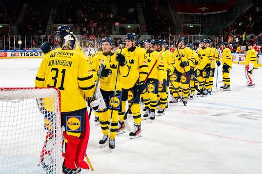Goaltender Lars Johansson and Lawrence Pilut of Sweden