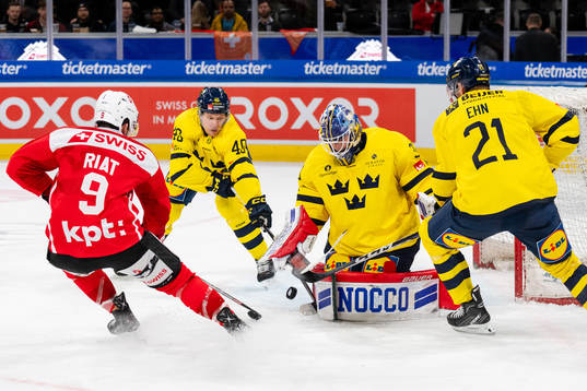 Lawrence Pilut, goaltender Lars Johansson and Christoffer