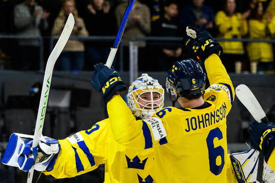 Goaltender Melker Thelin and Anton Johansson of Sweden