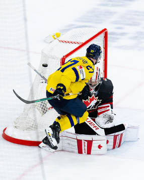 Oskar Pettersson of Sweden and goalkeeper Mathis Rousseau