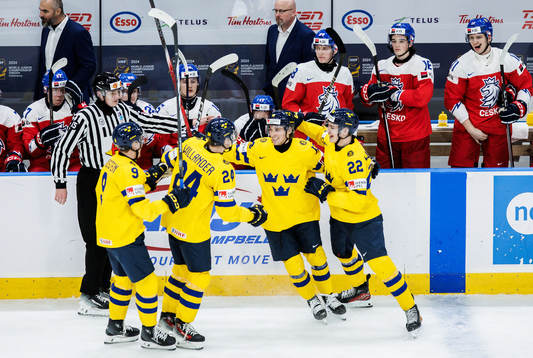 Noah Östlund of Sweden celebrates with teammates