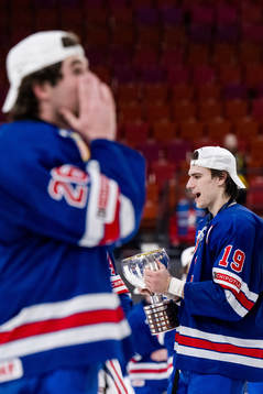 Cutter Gauthier of USA celebrates with the trophy