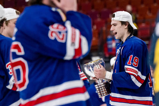 Cutter Gauthier of USA celebrates with the trophy