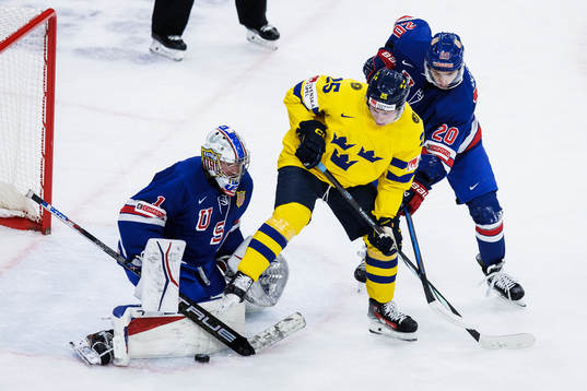 Goaltender Trey Augustine and Lane Hutson of USA and Otto