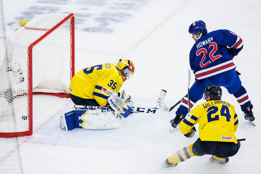 Isaac Howard of USA scores the 2-1 goal behind goaltender