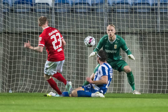 Tonni Adamsen of Silkeborg and Gustav Svensson and Goalkeeper Pontus Dahlberg of IFK Göteborg