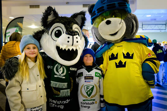Supporters of Sweden with Färjestads mascot Ture Varg and