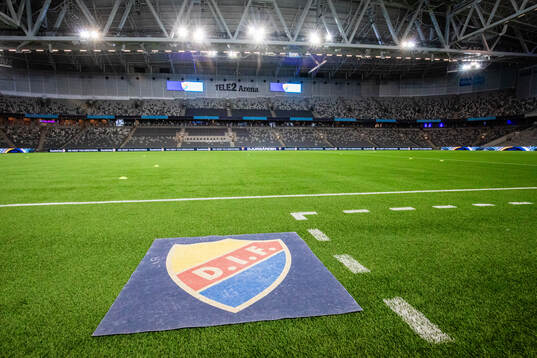 En matta med Djurgårdens logotyp inför