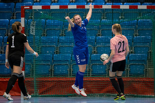 Andrea Holm Aune of Tiller celebrates after scoring the 2-1 goal