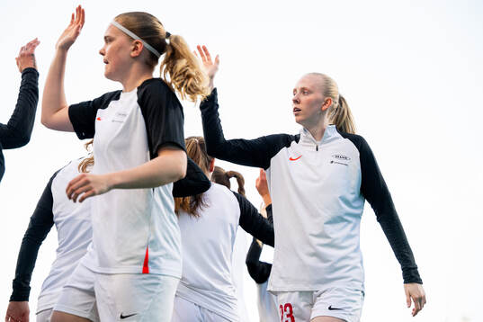 Signe Gaupset and Tomine Svendheim of Brann warm up ahead of the UEFA Women's Champions League quarterfinal football match between Barcelona and Brann on March 28, 2024 in Barcelona. 