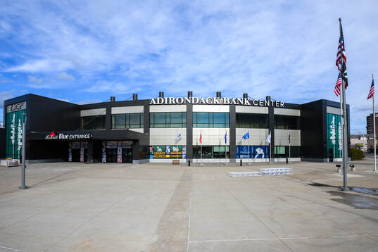 Exterior view of Adirondack Bank Center at a team photo