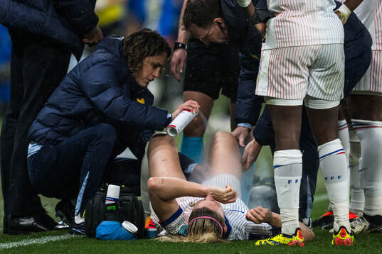 Eugénie Le Sommer of France in pain