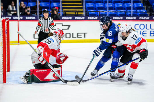 Goaltender Andrea Brändli of Switzerland, Petra Nieminen