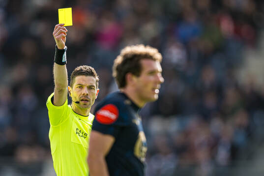 Joe Zen Robert Bell of Viking after receiving a yellow card by Tore Hansen, referee,