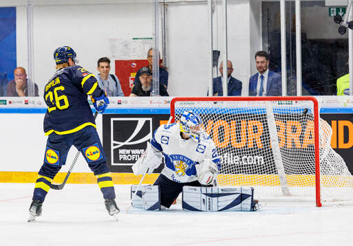 Rasmus Dahlin of Sweden and goaltender Harri Säteri of