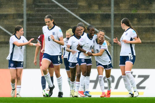 Omotara Junaid and Erica Parkinson of England celebrate the 3-0 goal