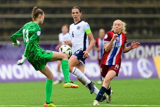 goalkeeper Rebekah Dowsett , Cecily Wellesley-Smith of England agasint Anny Kerim-Lindland of Norway