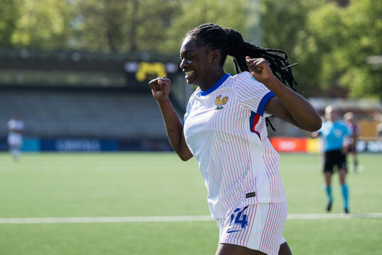 Rachael Abedini of France celebrates after scoring 0-5 