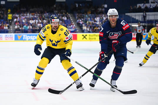 Erik Karlsson of Sweden and Shane Pinto of USA