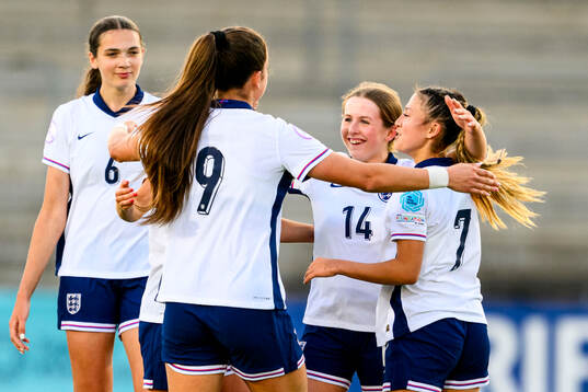 Emily Cassap of England celebrates with teammates