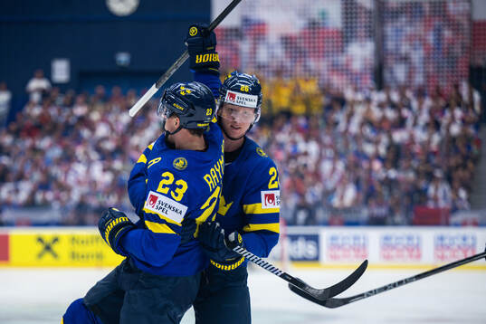 Lucas Raymond and Rasmus Dahlin of Sweden celebrate the 1-0