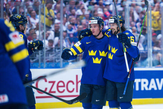 Erik Karlsson of Sweden celebrates with Victor Olofsson