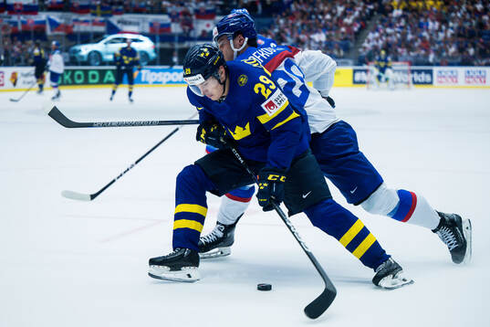 Pontus Holmberg of Sweden and Juraj Slafkovsky of Slovakia