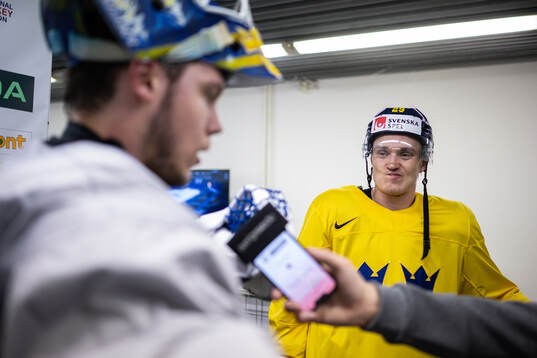 Goaltender Jesper Wallstedt and Pontus Holmberg of Sweden