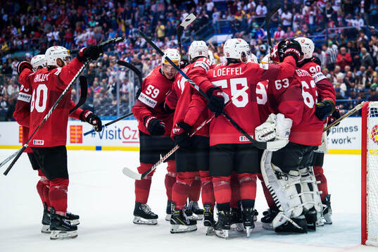 Goaltender Leonardo Genoni of Switzerland celebrates with
