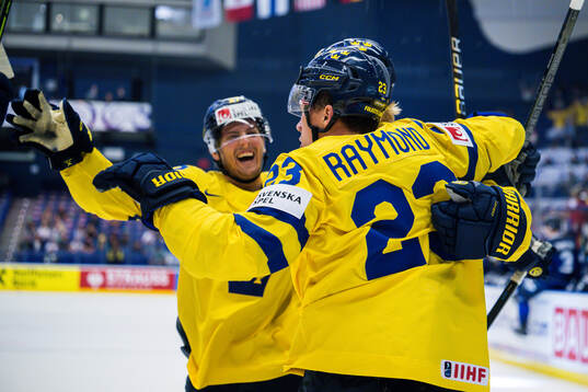 Isac Lundeström and Lucas Raymond celebrates
