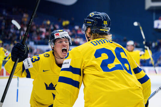 Lucas Raymond and Rasmus Dahlin celebrates