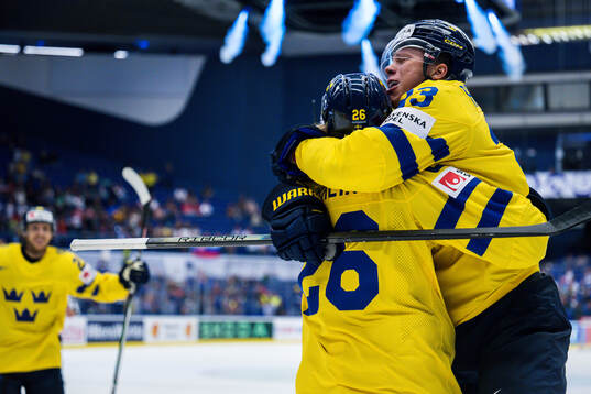 Lucas Raymond and Rasmus Dahlin celebrates