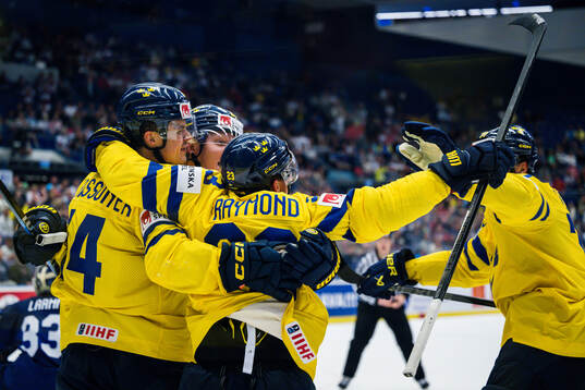 Joel Eriksson Ek of Sweden celebrates with team mates