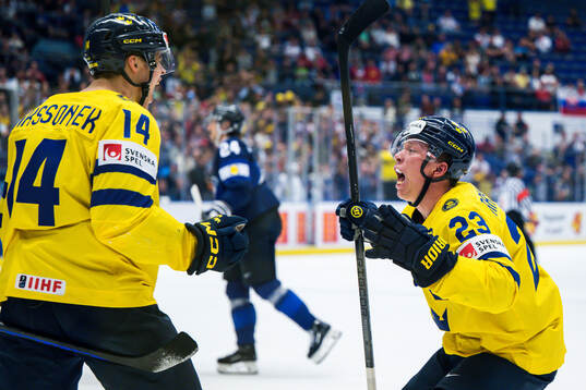 Joel Eriksson Ek and Lucas Raymond of Sweden celebrates
